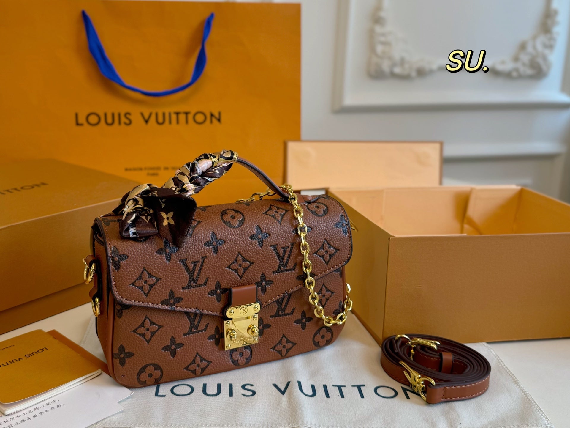 LV Embossed Messenger Bag