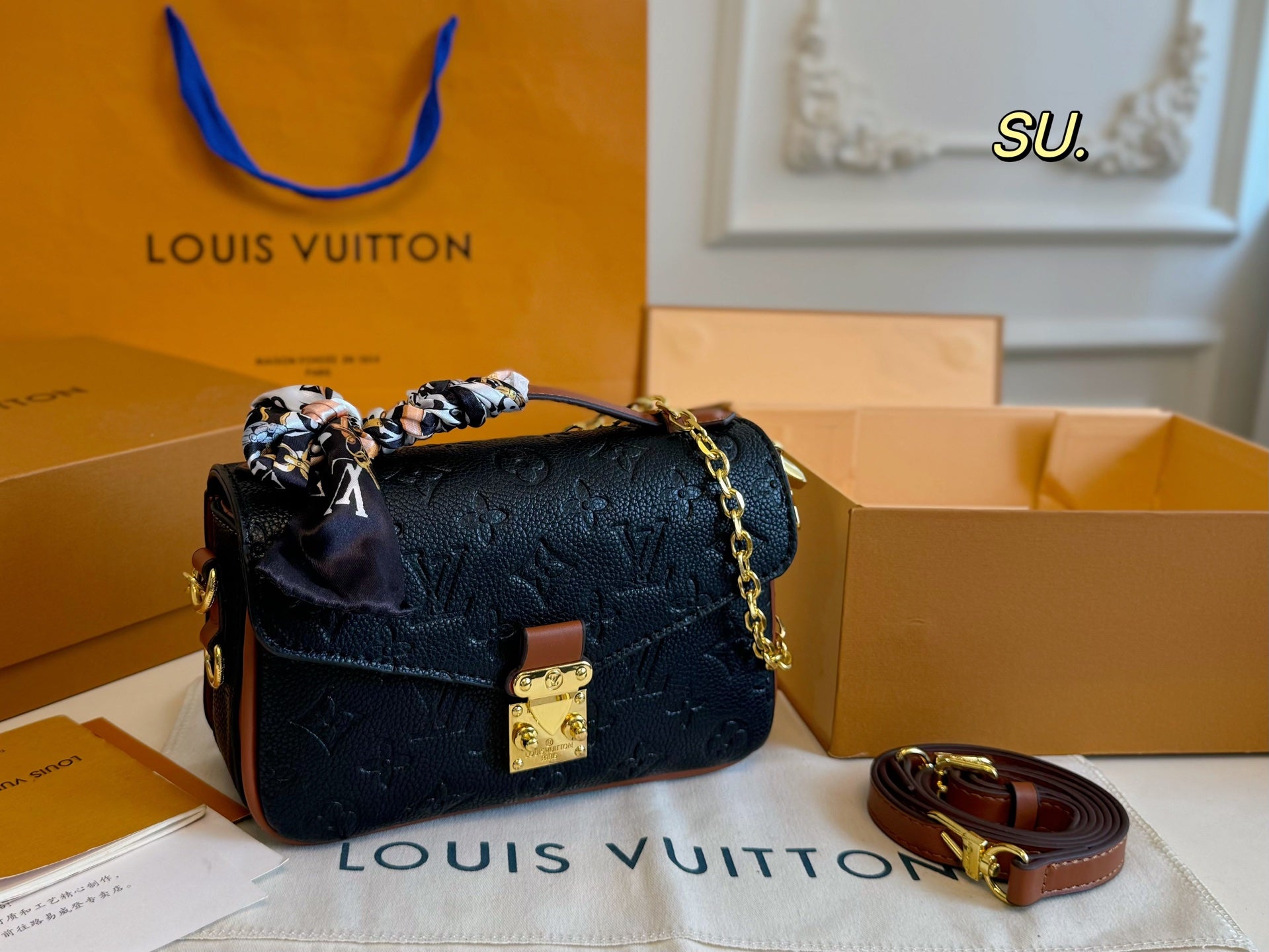 LV Embossed Messenger Bag