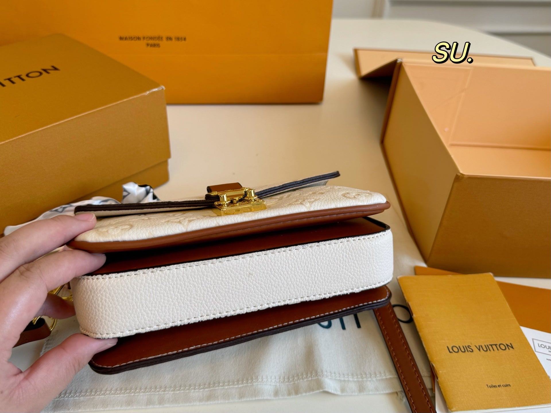 LV Embossed Messenger Bag